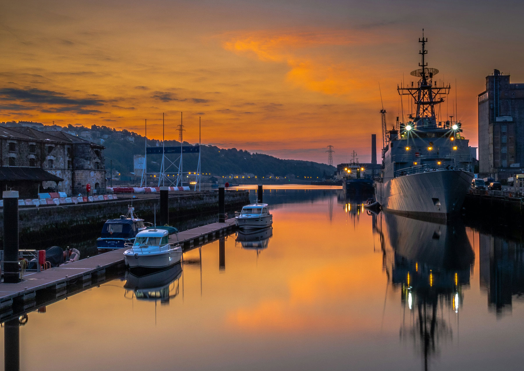Cork City at dusk. © Jamie O’Sullivan https://unsplash.com/photos/white-and-black-boat-on-dock-during-sunset-WAh9lIRcVaU